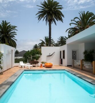 a swimming pool with palm trees